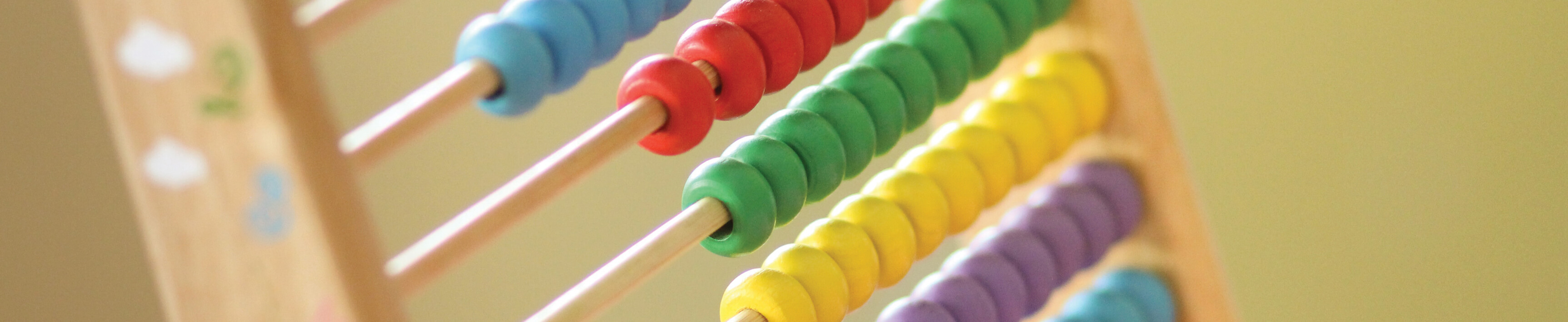 A wooden abacus with colored rows of beads